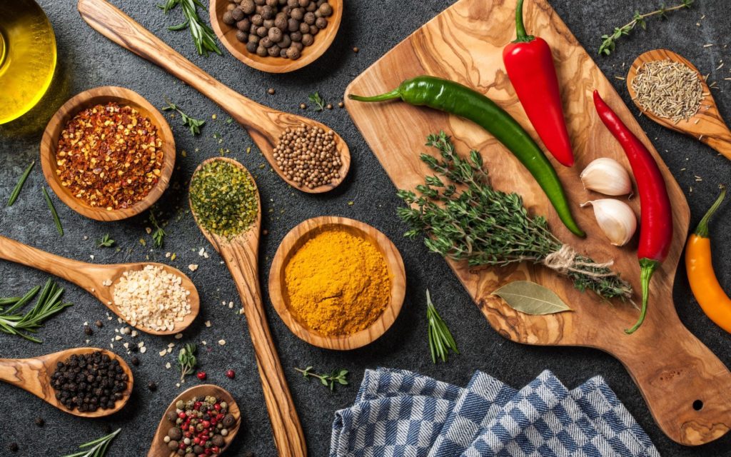 Cooking table with spices and herbs